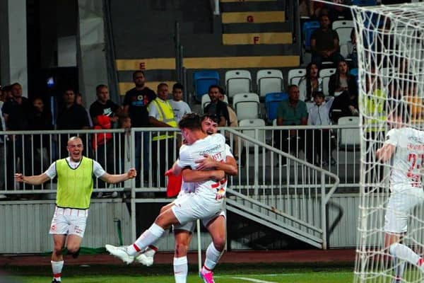 Larne's Lee Bonis celebrates with goalscorer Matty Lusty as the Irish Premiership champions defeated FC Ballkani 1-0 in the first leg of their UEFA Conference League qualifier in Pristina