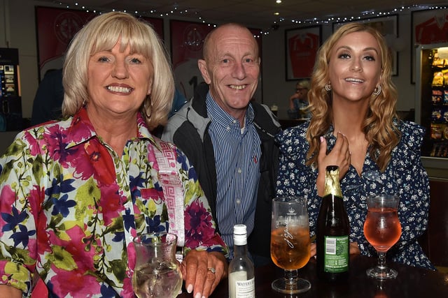 Smiling for the camera at the Naiscoil na Banna 25th anniversary evening are the Girvan family, from left, Paula, Anthony and Victoria. PT19-238.