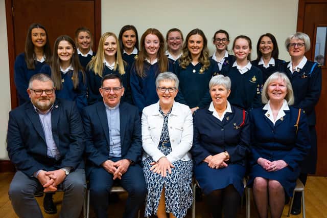 Officers, associates and chaplain of First Stewartstown Girls' Brigade alone with Guests of Honours, Mrs Jennifer Hagan and Rev Matthew Hagan.