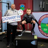 Greenisland FC manager Lee McCartney pictured alongside junior player Evan McCartney.