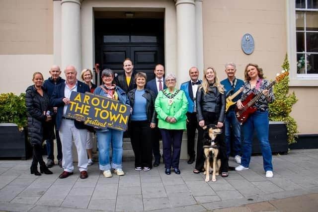 Around the Town' festival performers and organisers with MEA Mayor, Alderman Beth Adger MBE and Minister for Communities, Gordon Lyons at the festival launch in June. Photo: Positive Carrickfergus
