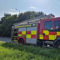 Firefighters are dealing with a blaze in Lurgan amid reports of a car on fire