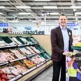Ian Logan, Tesco NI’s Retail Director, with a member of staff, announcing the company's refurbishment plans. Pic credit: Tesco