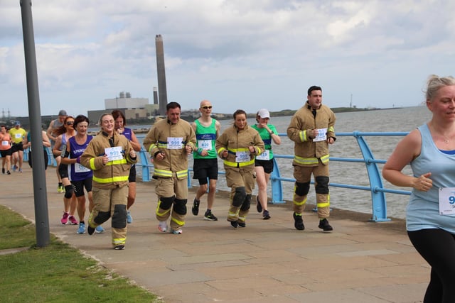 Firefighters Jeanna Robb, Andy Doey, Gary Scott and Cheryl Brownlee from Carrickfergus Fire Station were also running in their full fire kit.