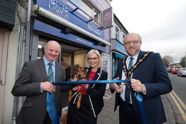 Chair of the USPCA, Dr John Farrell, Skye the dog, Chief Executive of the USPCA, Nora Smith, Lisburn and Castlereagh City Council Mayor, Andrew Gowan at the opening of the new USPCA store in Lisburn city centre. Pic credit: Matt Mackey