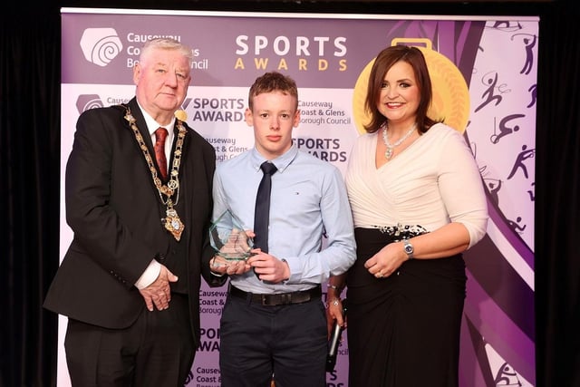 Junior Sportsman of the Year, Riley Brown at the 2023 Sports Awards with host Denise Watson and Mayor of Causeway Coast and Glens, Councillor Steven Callaghan.