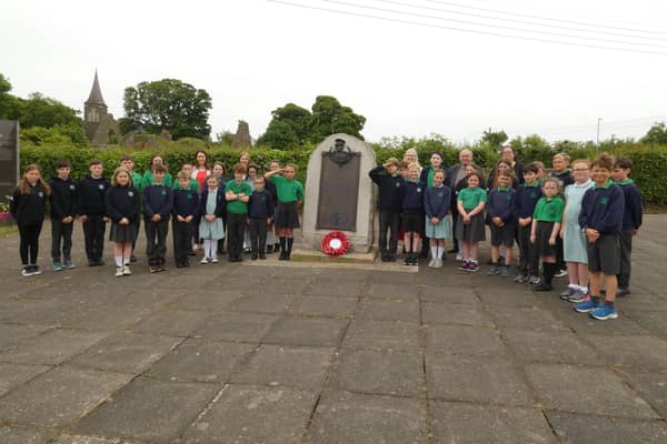 Ballycarry Primary School pupils at the General Steele memorial on the village green. Photo courtesy of Dr David Hume