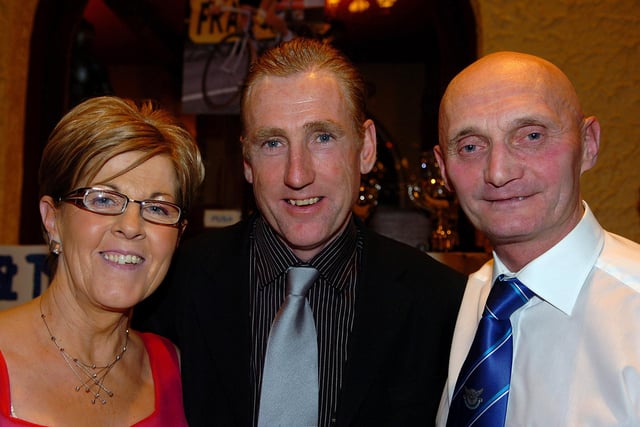 Former world  No 1 cyclist Sean Kelly who was special guest at the RT Autoparts East Tyrone CC 60th anniversary presentation dinner in 2007 pictured with club chairman Rod Davidson and his wife Ann.