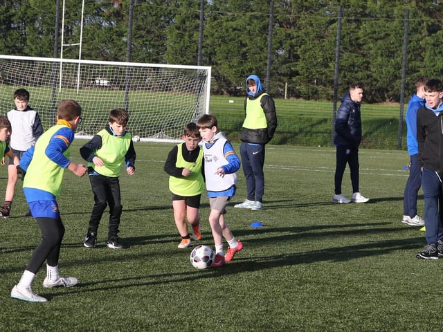 Pupils from Ballycastle High and Cross & Passion College who participated in “Different Ball Same Goal” sessions in Ballycastle during October. Included in the photo is John Fall Sports Development Manager (Sport & Wellbeing).