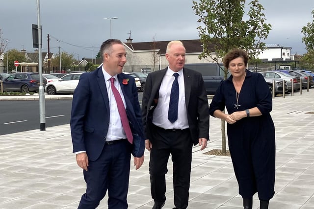 Education Minister Paul Givan is welcomed to Mill Strand Integrated Primary School in Portrush by principal Philip Reid and Chair of Governors Louise Rossington.