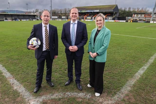 Peter Clarke, chairman of Carrick Rangers, with Communities Minister Gordon Lyons and Cheryl Brownlee MLA at the Lougview Leisure Arena.