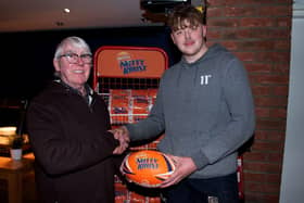 Banbridge's Ryan McMurray receives the Man Of The Match Award from Calvin Rowe, of the tournament committee