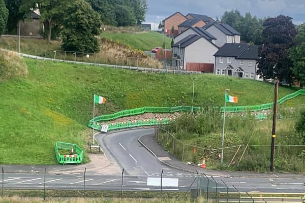 Flags at entrance to new housing development on Killymeal Road, Dungannon. Credit: Tom Elliott