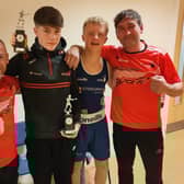 Charlie Mulligan and Cayden Cummings from Cookstown Boxing Club pictured with their coaches in Wales. Credit: Submitted
