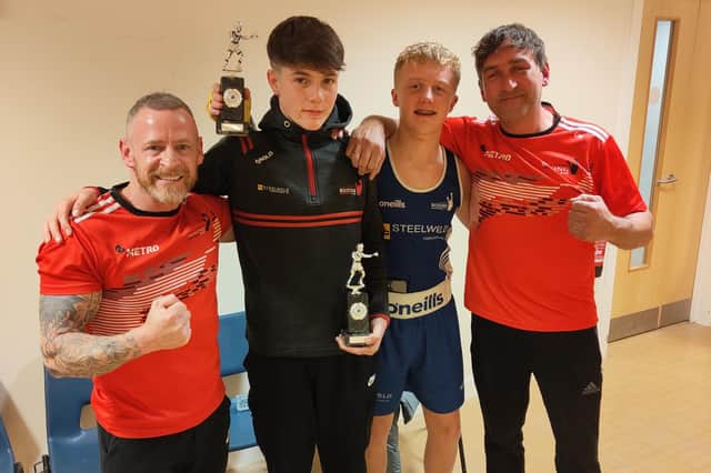 Charlie Mulligan and Cayden Cummings from Cookstown Boxing Club pictured with their coaches in Wales. Credit: Submitted