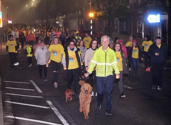 Hundreds of walkers on their way through Cookstown in the early morning Darkness into Light Walk organised by The Hub, Cookstown.