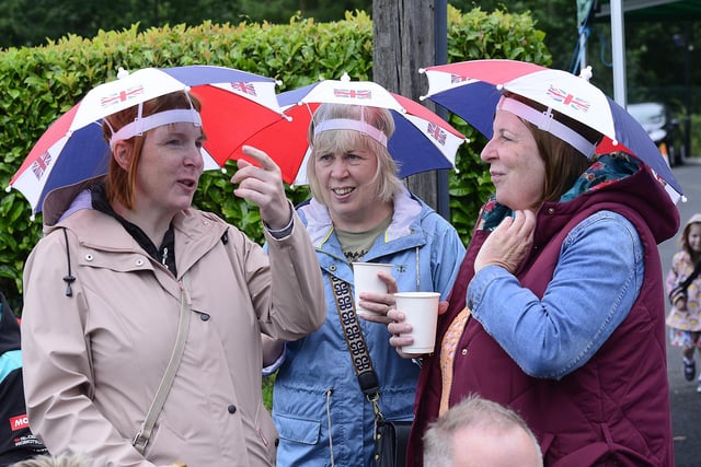 Making the best of the wet weather in Randalstown with smart headgear.
