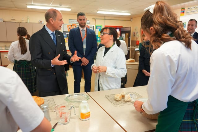 The Duke of Edinburgh picks up traditional soda bread baking skills during his visit to St Catherine's College.