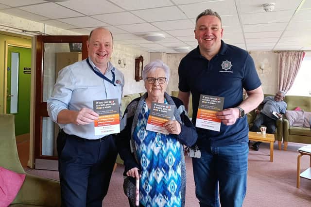Andrew, Ballymena Rural Warden; a resident of Cullybackey Fold and Paul, PSNI Crime Prevention Officer educate senior citizens on scams.  Photo: MEABC