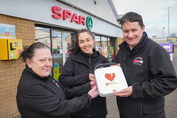 Jacqueline Funton, Joanne Tweed and Peter Kaye from SPAR Craigyhill who have fundraised with their shoppers to install an Automated External Defibrillator outside their store in Larne.