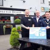 Tyler McConnell (McConnell’s of Doagh), Andy Clement, (DfC) and Mayor of Antrim and Newtownabbey, Cllr Mark Cooper. (ANBC).