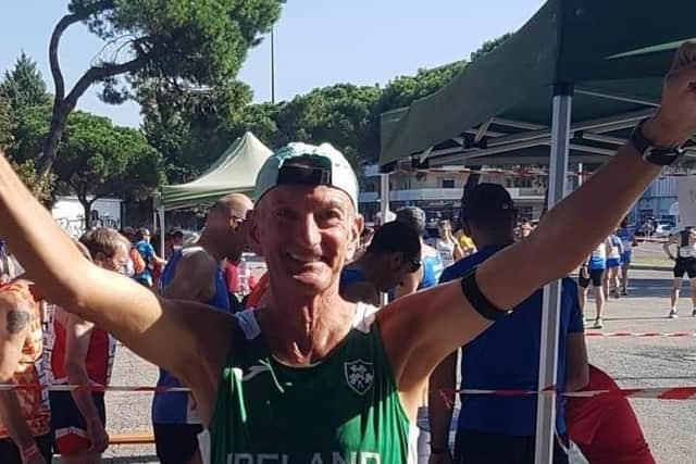 NCR member Terry O'Hare celebrates after he completed the Pescara 10K.
