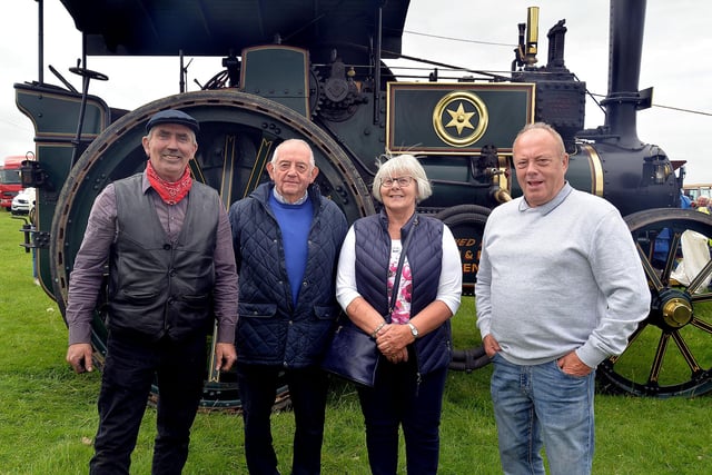 Eamon McAleenan, left, owner of the magnificent steam traction engine which was a big draw at the Birches Vintage Rally, with, from left, John Wilson MBE, Daphne Wilson and Alan Kerr. PT27-206. Photo by Tony Hendron