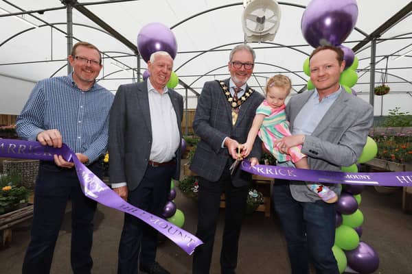 Three-year-old Reya Mercer officially declares Hillmount Carrick open, included are the Mayor of Mid & East Antrim Borough, Alderman William McCaughey and David, Robin and Alan Mercer. Photo: submitted