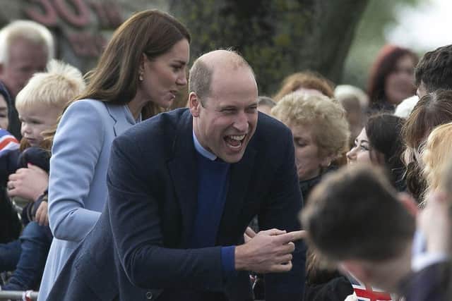 The Prince of Wales enjoys a light-hearted moment with members of the community. PACEMAKER BELFAST