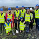 Education Permanent Secretary, Dr Mark Browne; Arlene Cambridge, principal; William Kane, chair of the board of governors and pupils cutting the first sod to officially mark the beginning of construction works at Islandmagee Primary School