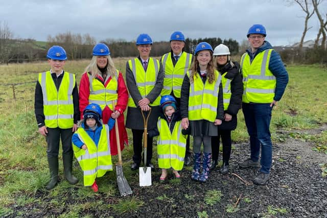 Education Permanent Secretary, Dr Mark Browne; Arlene Cambridge, principal; William Kane, chair of the board of governors and pupils cutting the first sod to officially mark the beginning of construction works at Islandmagee Primary School