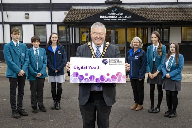 The Mayor of Causeway Coast and Glens Borough Council, Councillor Ivor Wallace, pictured at the launch of the Digital Schools programme with pupils from North Coast Integrated College in Coleraine and Sharon Barrett and Jane Hanna, Area Managers with entrepreneurship charity Young Enterprise