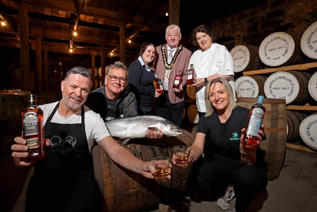 Mayor of Causeway Coast and Glens, councillor Steven Callaghan pictured with Gary Stewart, owner of Tartine at the Distillers Arms, Ruaridh Morrison, owner of North Coast Smokehouse, Laura Adams from Bushmills Distillery, celebrity chef Paula McIntrye and Wendy Gallagher from Causeway Coast Foodie Tours at the recent launch of the Bushmills Salmon and Whiskey Festival 2023
