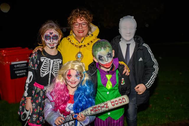 Mid and East Antrim Mayor, Alderman Gerardine Mulvenna with some young visitors at Larne Town Park's Halloween Hooley.  Photo: Pacemaker