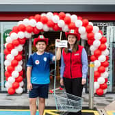 St. Joseph’s Primary School pupil Daíthí McGeary is pictured with Gillian Hunter, store manager at EUROSPAR Donaghmore, who welcomed Daíthí to the store’s official opening after he wrote to the store to say he’d like to work in a SPAR. Credit Ricky Parker Photography