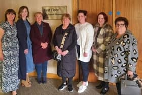 The ‘Ladies with Letters’ campaigners (pictured in December 2024), along with elected representatives supporting them. From left: Cllr Julie Flaherty BEM, Tracey Bell, Heather Thompson, Liz Beattie, Cllr Clare McConville-Walker, Olivia McAlinden, and Cllr Flaherty’s mother, Mrs Lorraine Hunniford. Credit: Keith Ratcliffe