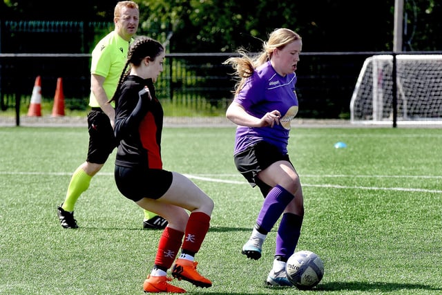 Brownlow Integrated College (purple) players show off their soccer skills. PT21-228.