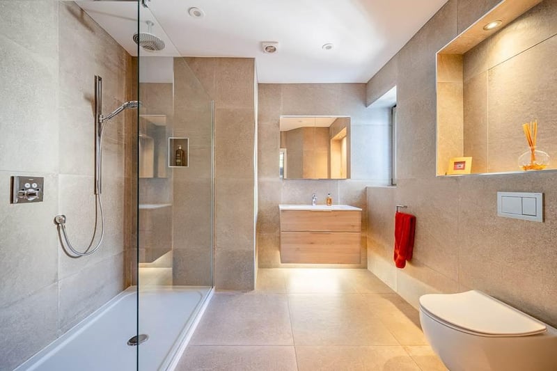 Modern bathroom with walk-in shower.