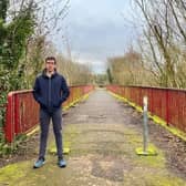 Armagh, Banbridge and Craigavon Councillor Robbie Alexander at the Moylinn Bridge in Craigavon before it was razed to the ground earlier this year.