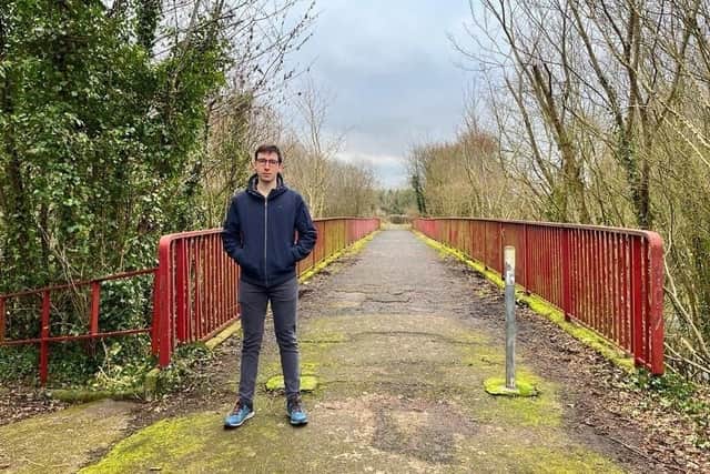 Armagh, Banbridge and Craigavon Councillor Robbie Alexander at the Moylinn Bridge in Craigavon before it was razed to the ground earlier this year.
