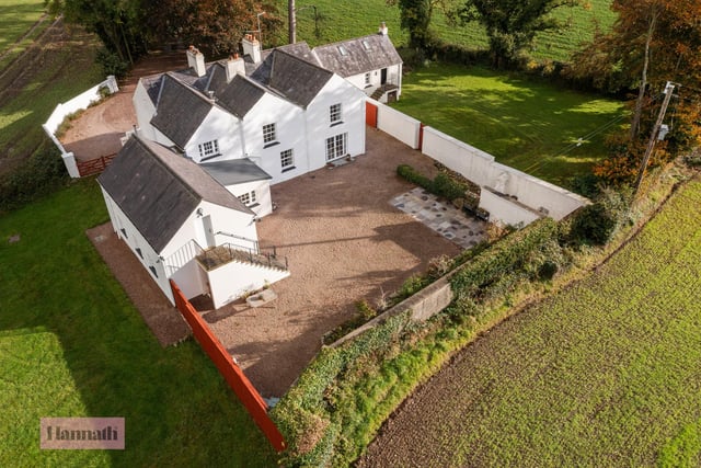 The property is accessed by a mature tree lined drive, gravel surface forecourt, walled courtyard with natural stone paved patio, planted boarder with fruit trees, large south facing garden and a paddock all of which add to its character.