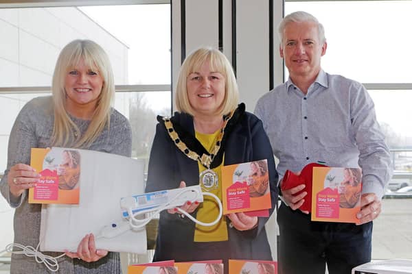 Deputy Mayor Councillor Margaret Ann McKillop joins Council staff Sharon McAfee Head of Health and Built Environment and Nicky Matthews Building Control Manager to promote the Stay Warm Stay Safe Campaign. Credit Causeway Coast and Glens Council