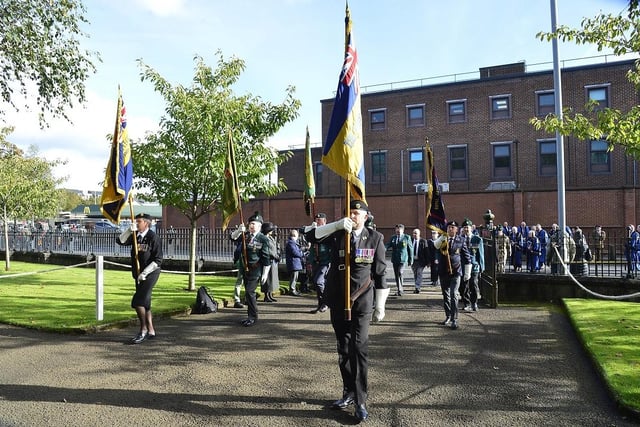 Standard bearers entering Ballymena Memorial Park.