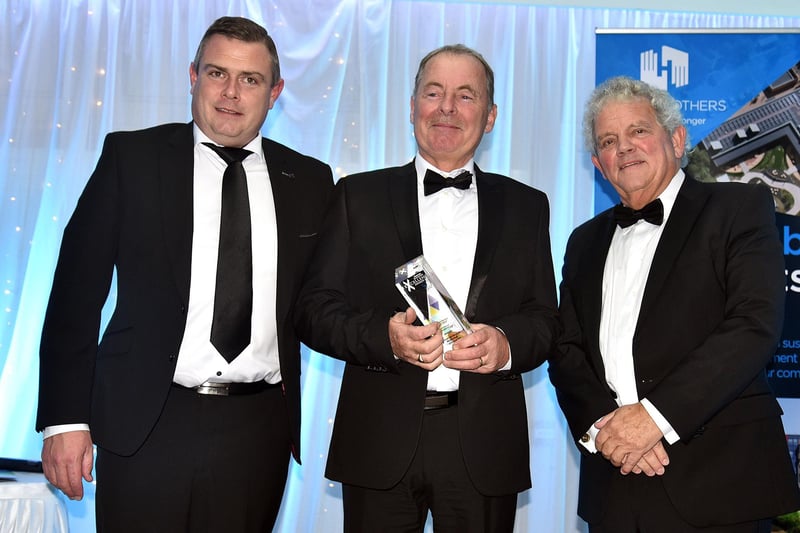 Winner of the Business Person of the Year Award, Michael McNicholl of McNicholl Caravans receives his trophy which was presented by Ciaran O'Hagan, left, Group Managing Director at the Specialist Group. MU46-225.