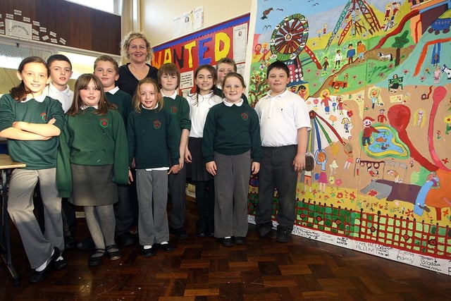 Pupils from Brownlee Primary School invited Artist Angela Ginn into the school in 2007 to create a Playground Mural