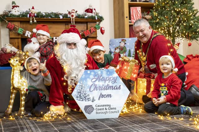 The Mayor of Causeway Coast and Glens Council Councillor Ivor Wallace and his grandchildren join Santa to launch this year’s festive programme