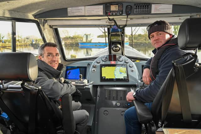 DAERA Minister Andrew Muir (left) takes a boat trip across Lough Neagh with Skipper and Fisheries Officer Eoin McFadden. Credit Simon Graham