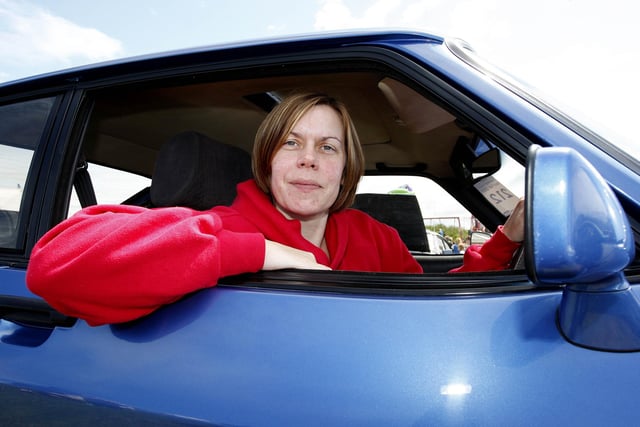 Julie Kelly relaxes in her Ford Capri during the Ford Fair at the Dunluce Centre in 2009