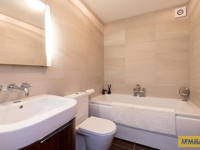 Bathroom with modern white suite.