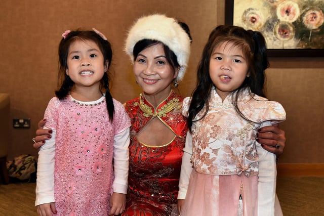 Suzie Lau pictured with two of her grandchildren, Layla (4), left, and Everley (3) at the Chinese New Year celebrations. PT04-215.